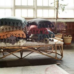 Futon beige frangé